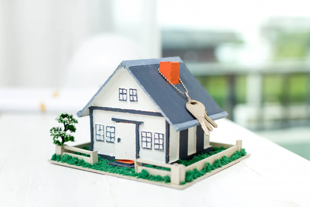 real-estate-with-house-model-keys (1)